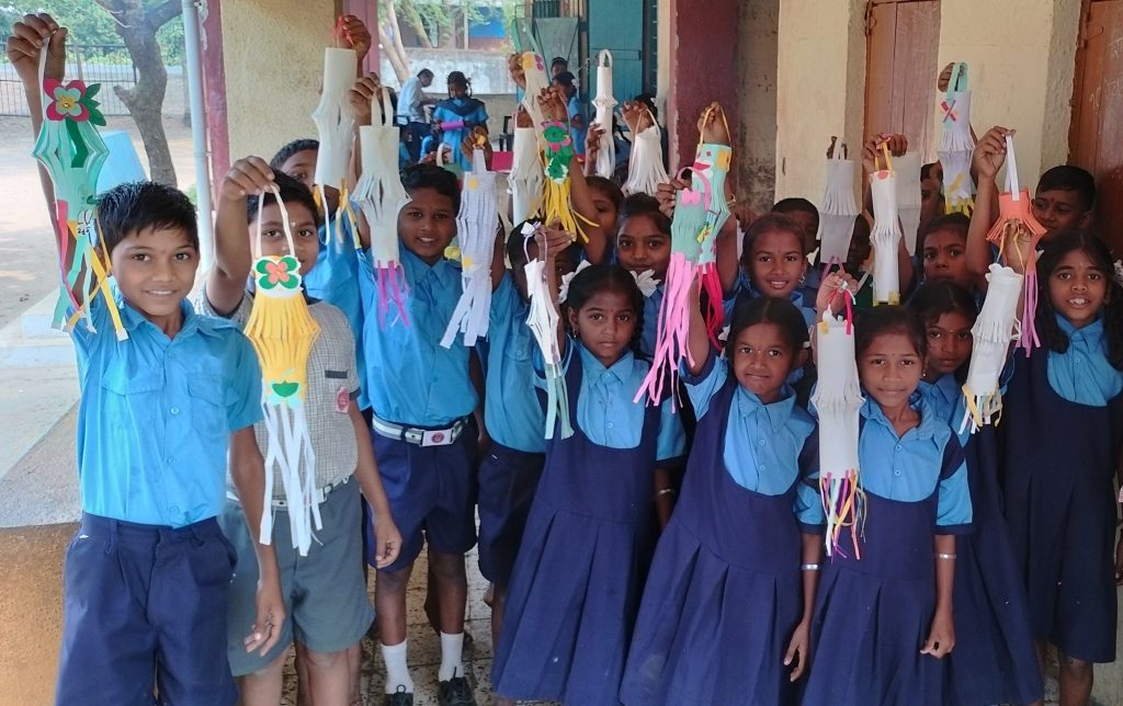 School children holding their projects