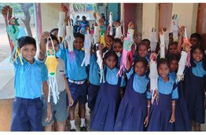 school children holding their projects